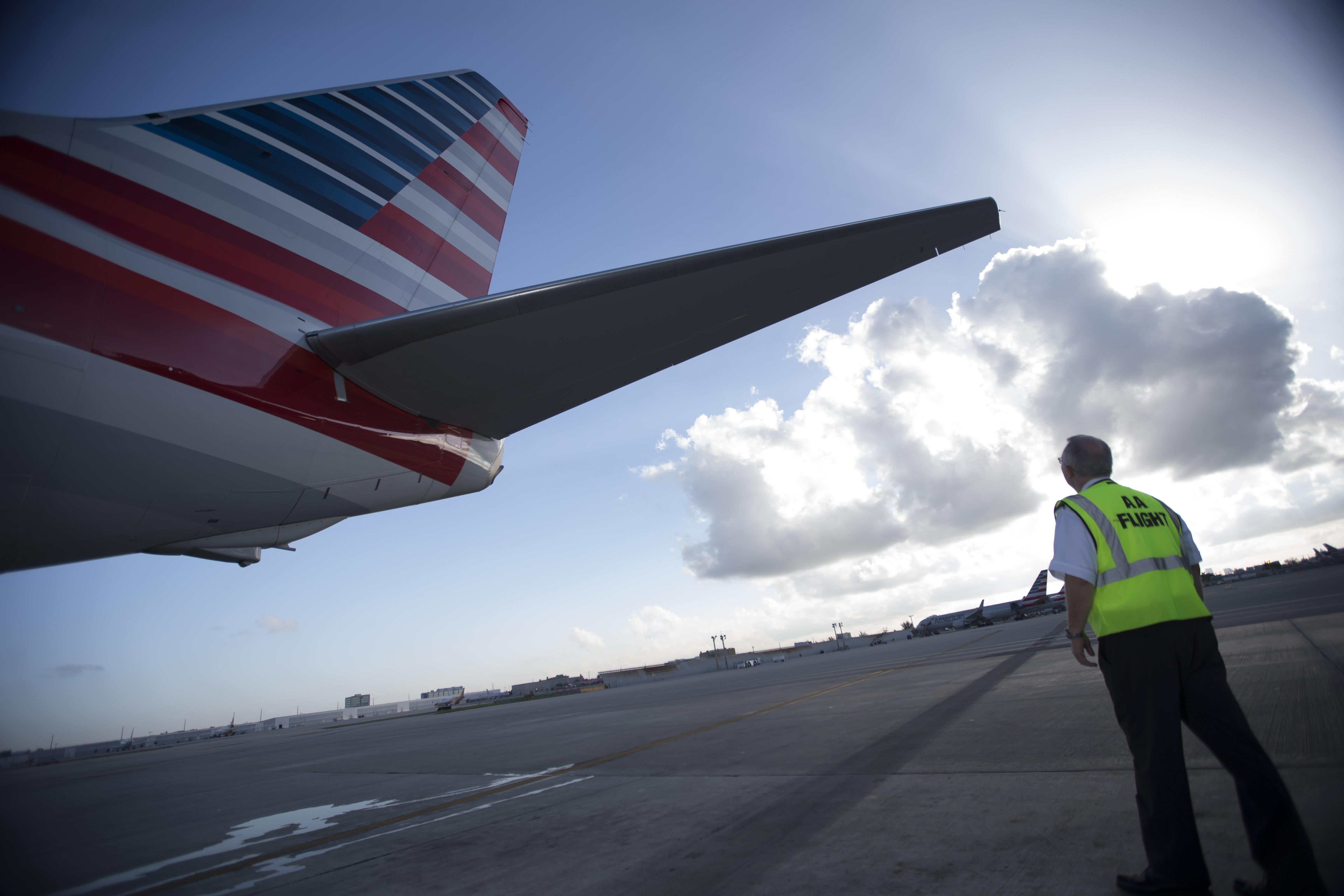 American Airlines pilot checking aircraft tail