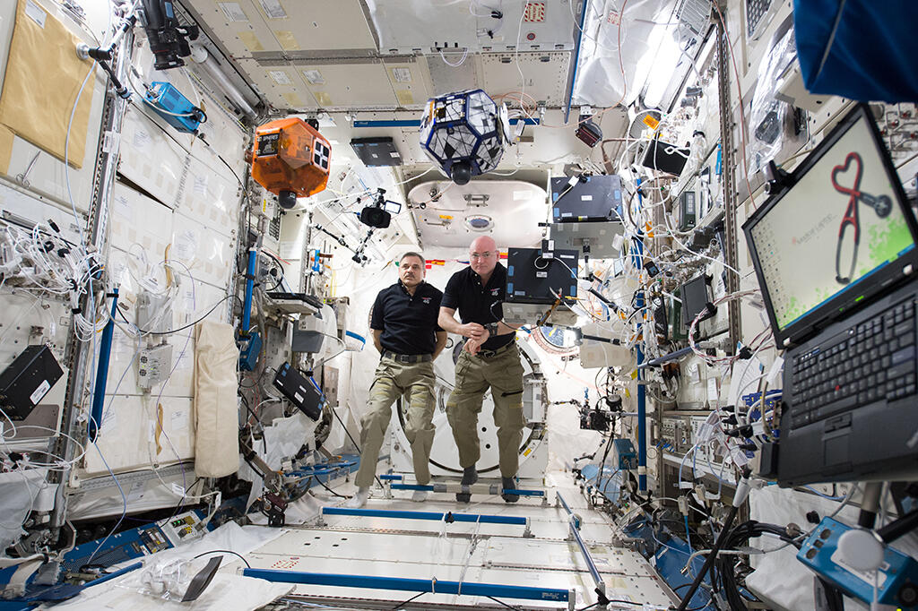 astronauts aboard Soyuz space capsule
