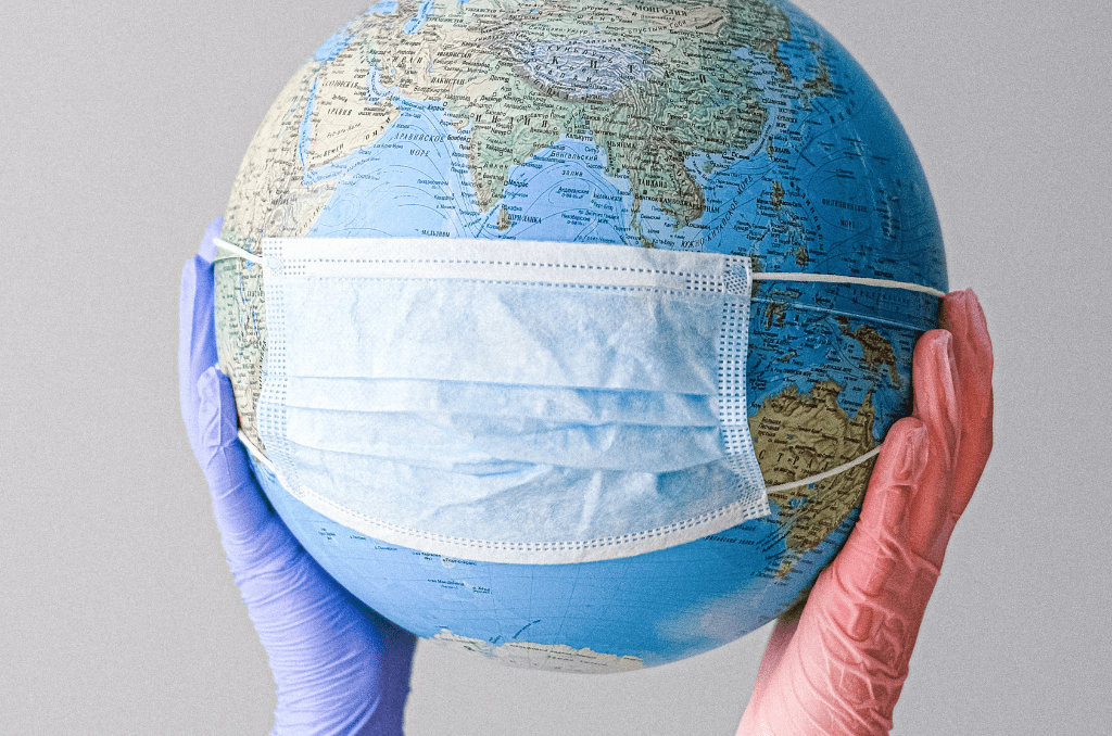 covid mask on globe