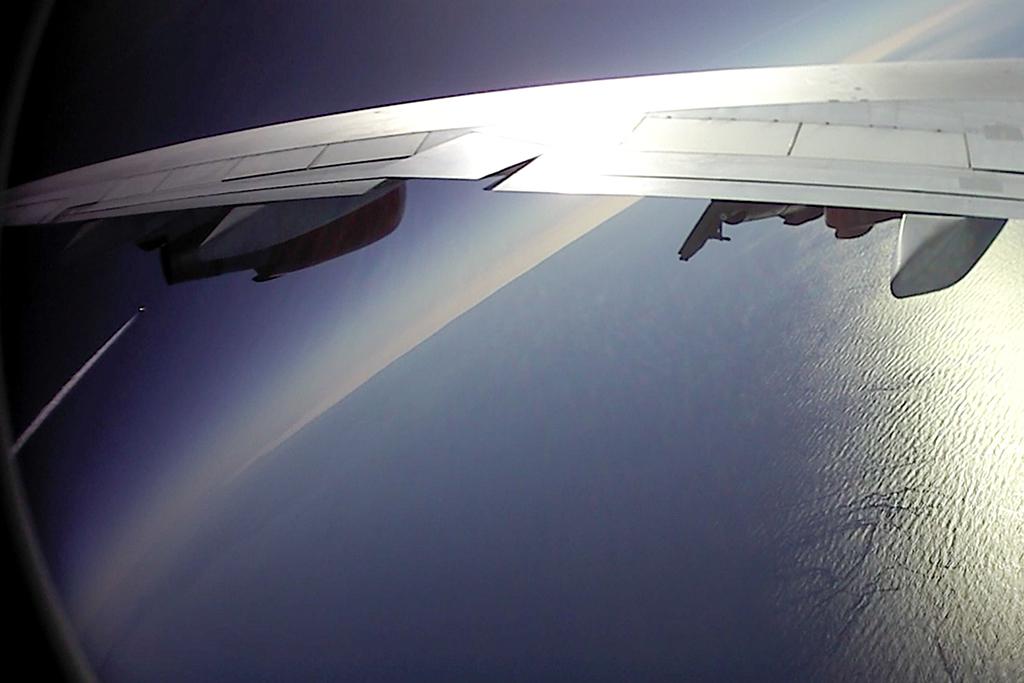 virgin orbit cosmic girl carrier aircraft banking away from launcherone