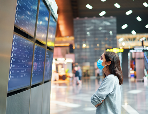 masked passenger in airport