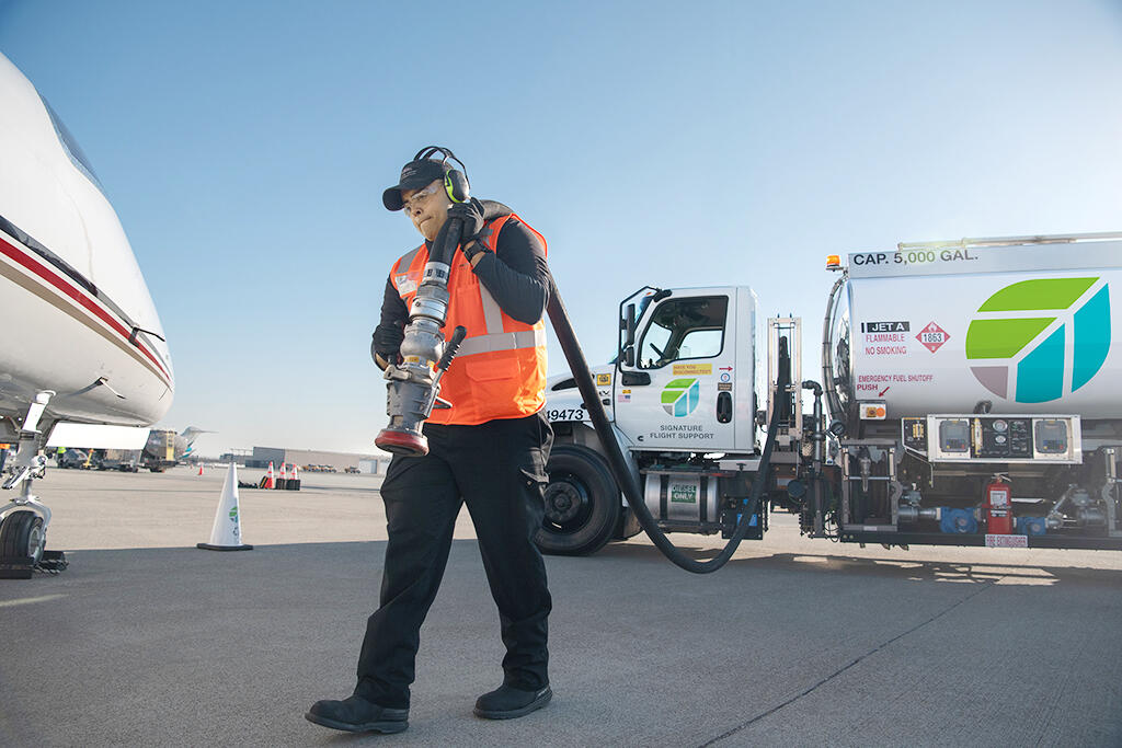 Signature Flight Support fuel truck and worker