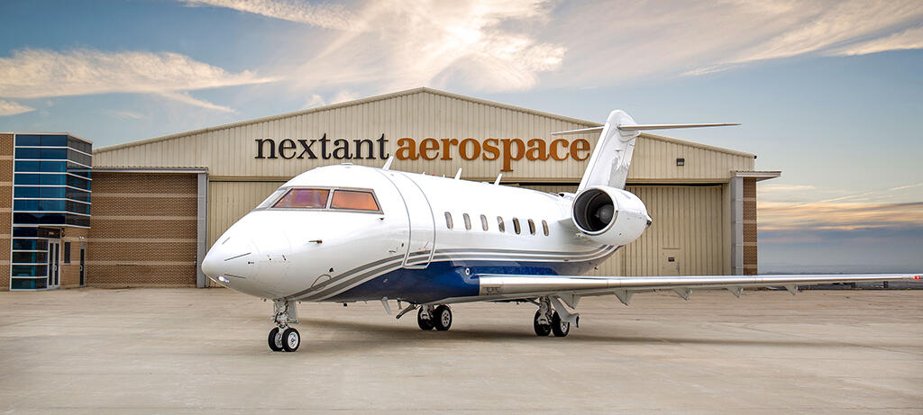 Nextant Challenger 604XT at Constant Aviation hangar