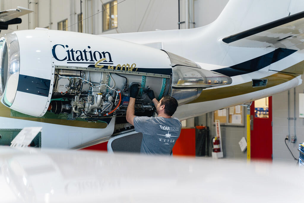 Stevens Aerospace technician works a Citation Encore port engine