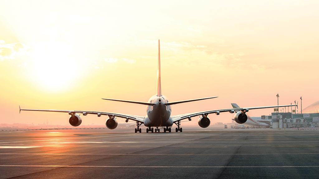 aircraft on tarmac at sunset