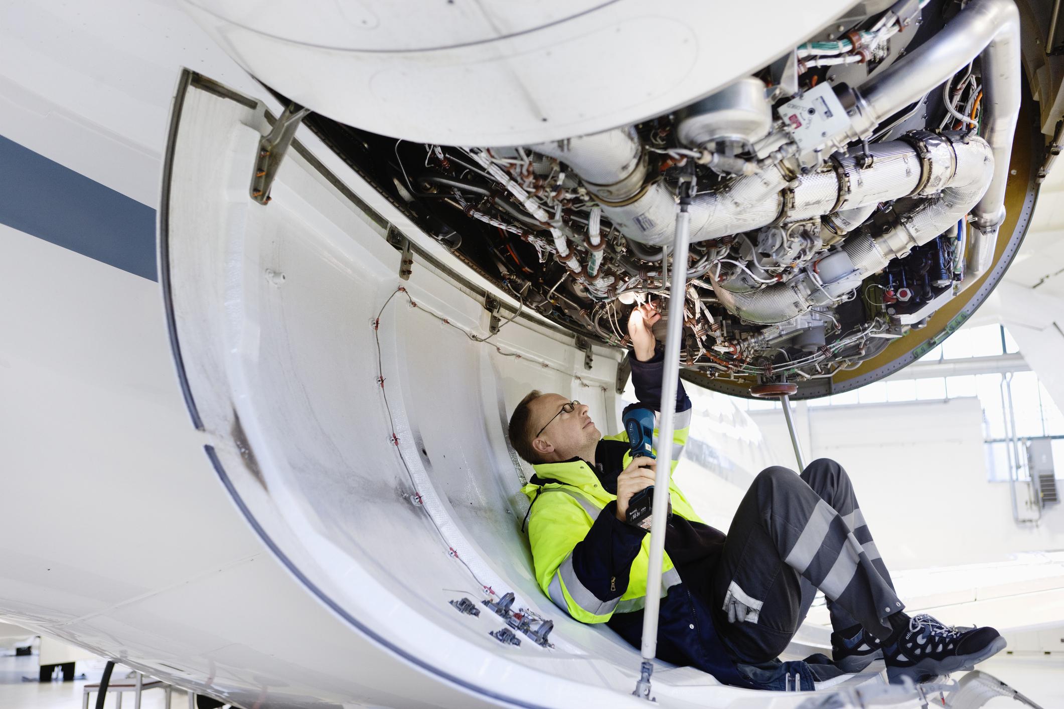 mechanic fixing engine