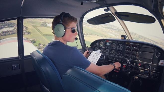 Pilot Eli Foltz with his yoke-mounted checklist flying a Piper Cherokee (PA-28). Credit: Steven Foltz