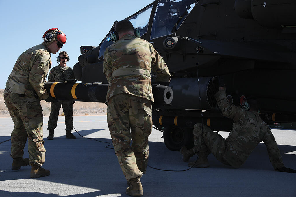 soldiers loading a missile