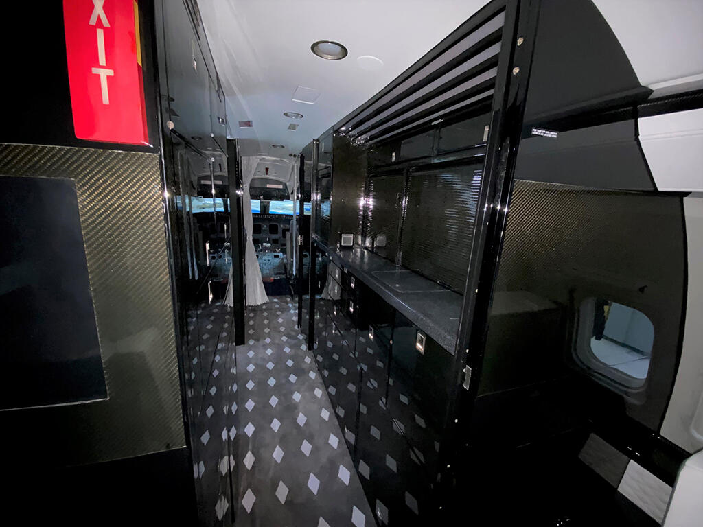 Challenger 850, refurbished galley area showing carpet and lavatory