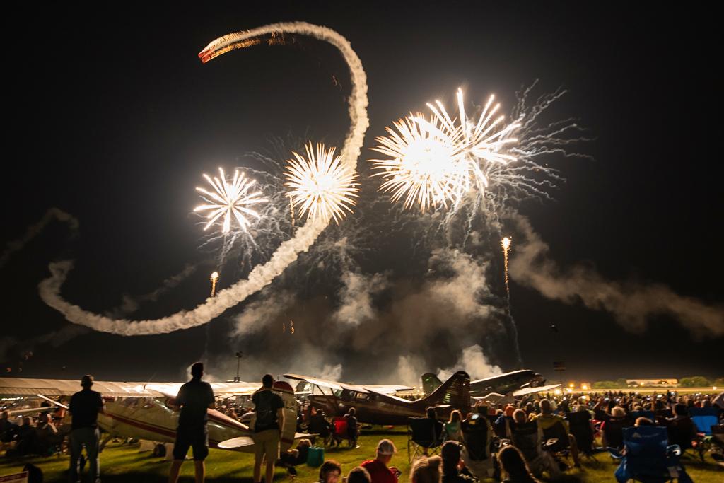 Havilland Canada DHC-1 Chipmunk pass during fireworks at EAA AirVenture Oshkosh 2022