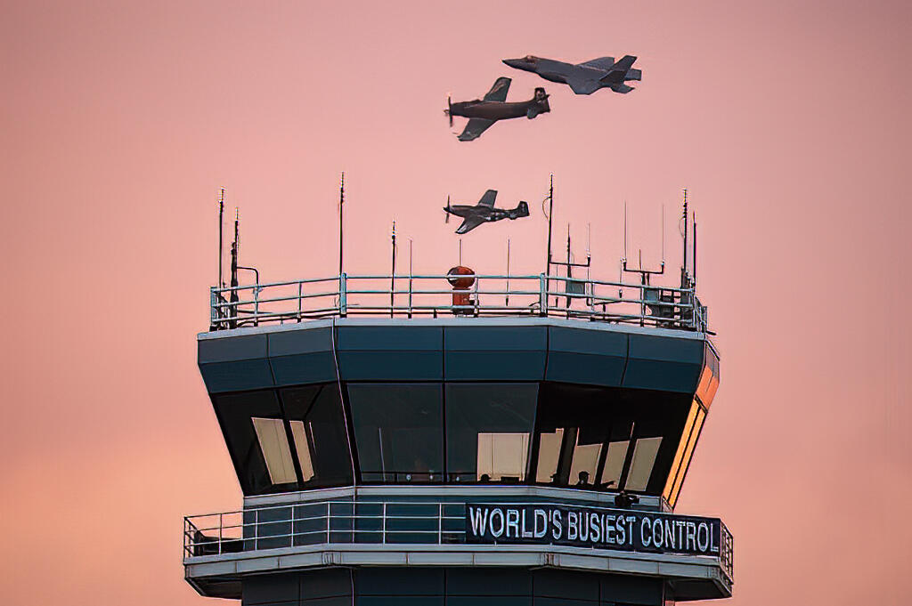 Wittman Regional Airport tower with Air Force Heritage Flight, A-1 Skyraider, P-51 Mustang and F-35 Lightning II in the background