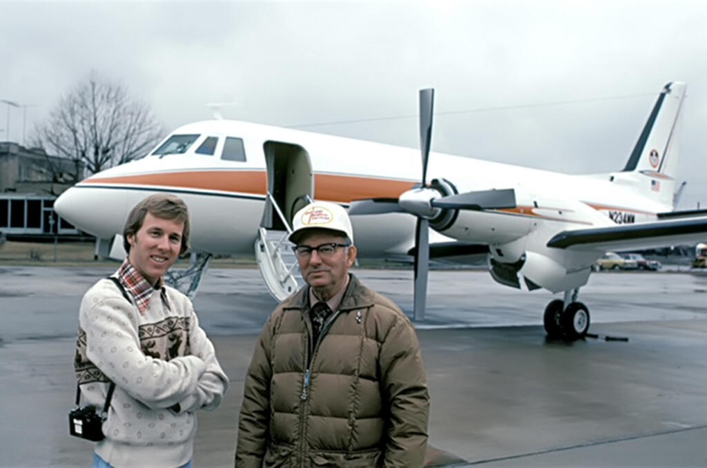 Mark and Chuck Malone in front of Walt Disney's Gulfstream