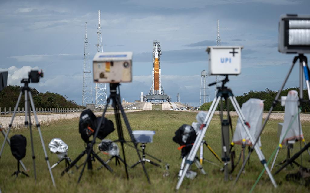 cameras on tripods facing launch site