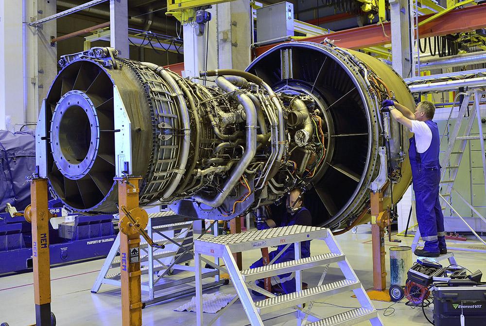 Technician working on engine