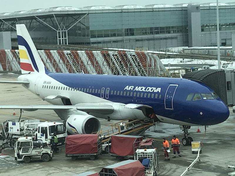 air moldova jet on tarmac with ground handling equipment