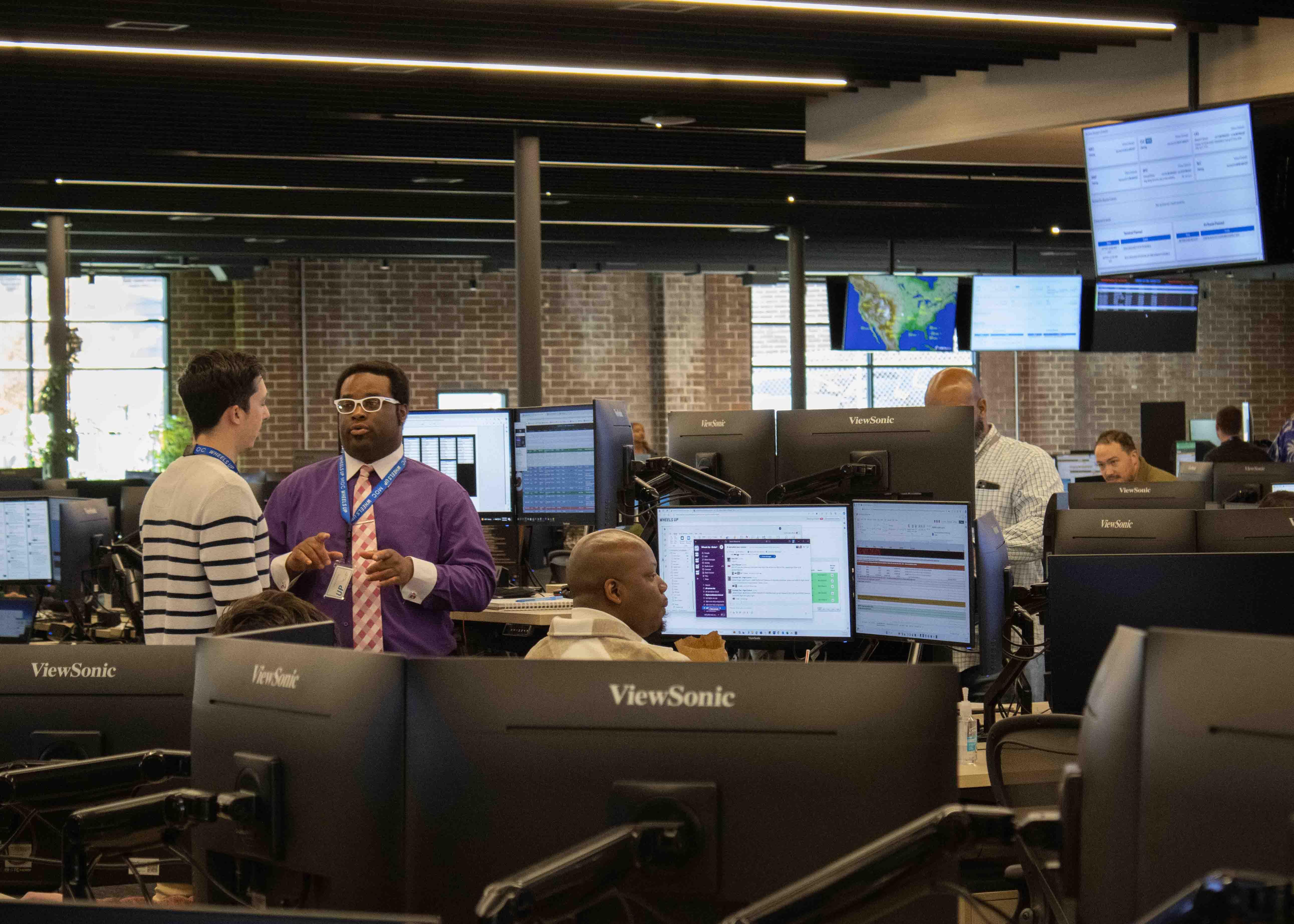 Two Wheels UP employees inside MOC workspace