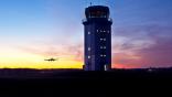 ATC tower and plane landing