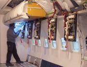 Man inspecting aircraft cabin 