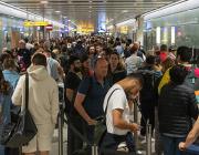 people waiting at airport terminal 