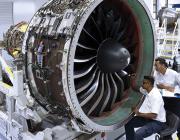 aircraft technicians working on geared turbofan engine