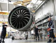 Lufthansa Technik technician with engine