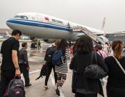 passengers boarding Air China aircraft